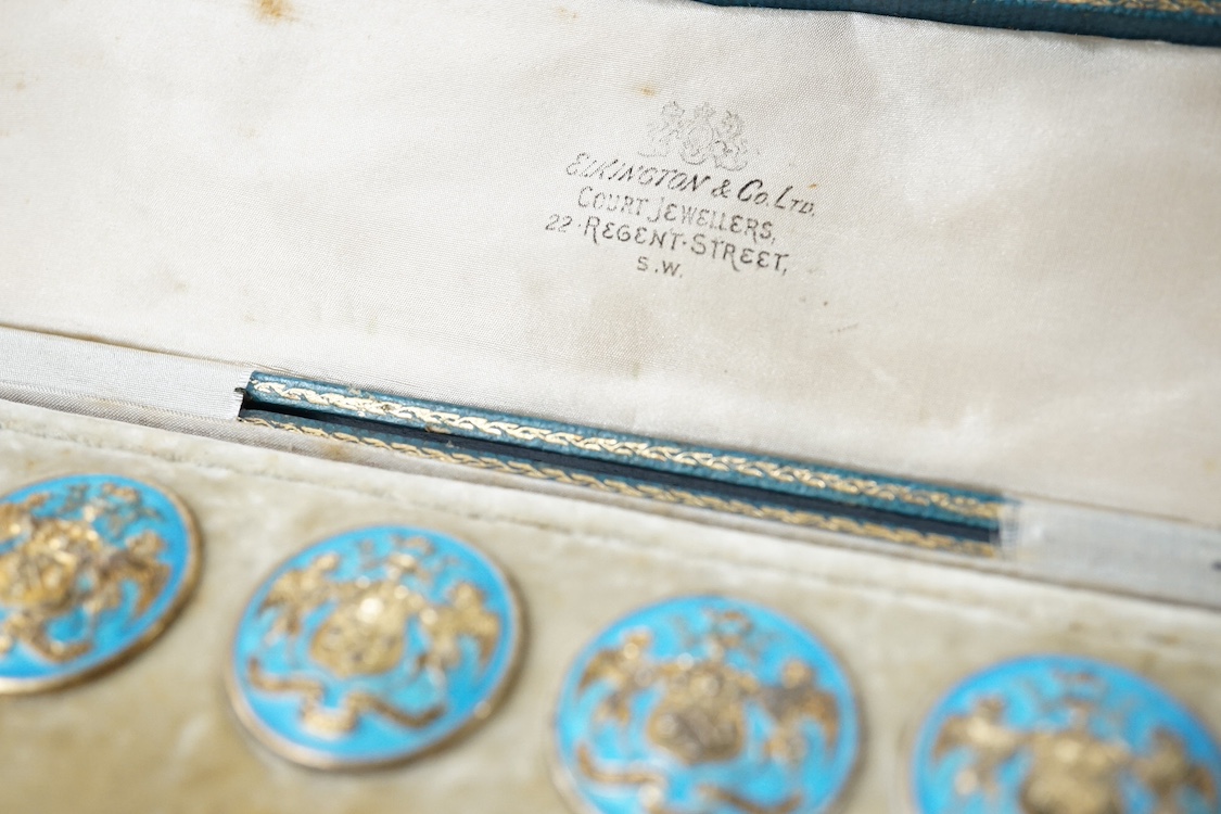 A George V set of 6 blue enamelled silver gilt buttons with armorial and motto 'cumnia subjescisti subpedieue oves et loves', Elkington and Co, Crown Jewellers, Chester 1904, in original case inscribed 'With The Complime